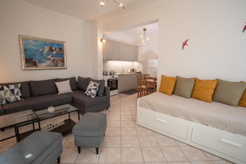 a living room with a bed and a couch at Apartment with view in Kiveri, near Nafplio in Kivérion