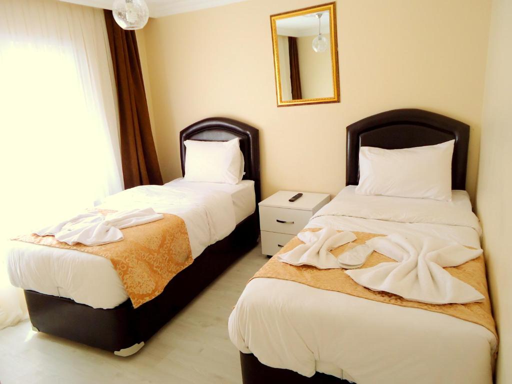 Postel nebo postele na pokoji v ubytování Tolga Hotel