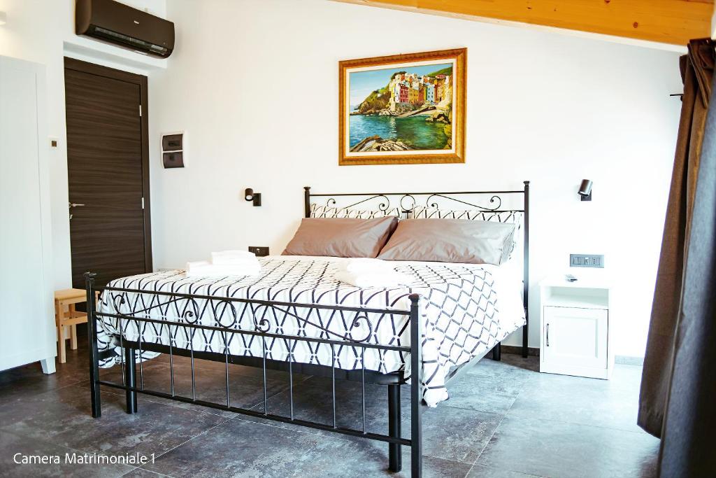 Postel nebo postele na pokoji v ubytování Le Camere Di Paolo