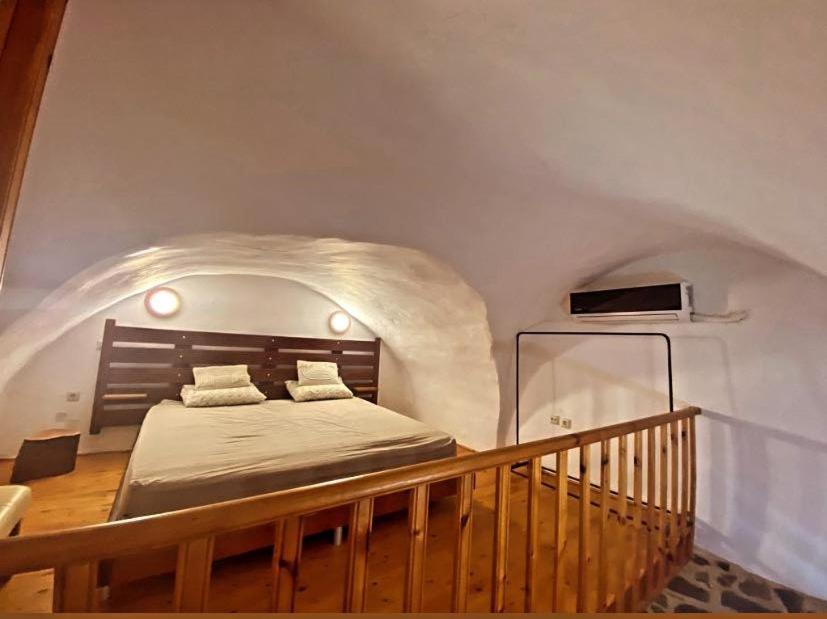 a bedroom with a bed in an attic at August castle house in Mestá