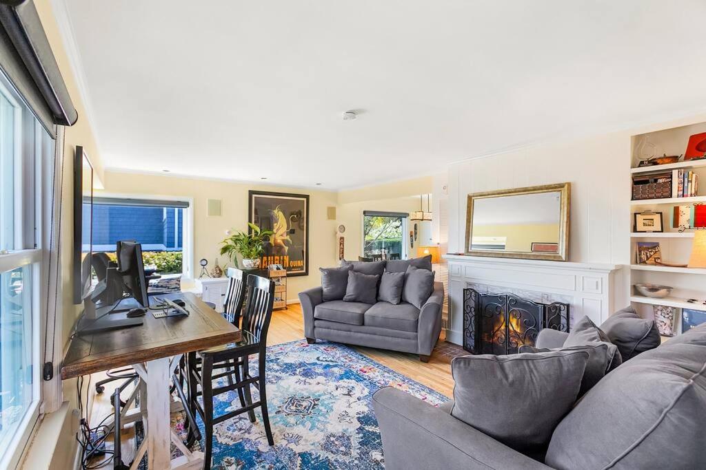 a living room with a couch and a fireplace at Magnolia on the Hill in Seattle