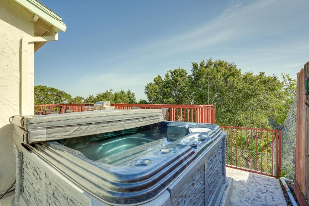 a swimming pool on the side of a building at Vallejo Home with Spacious Deck, Hot Tub and Views in Vallejo