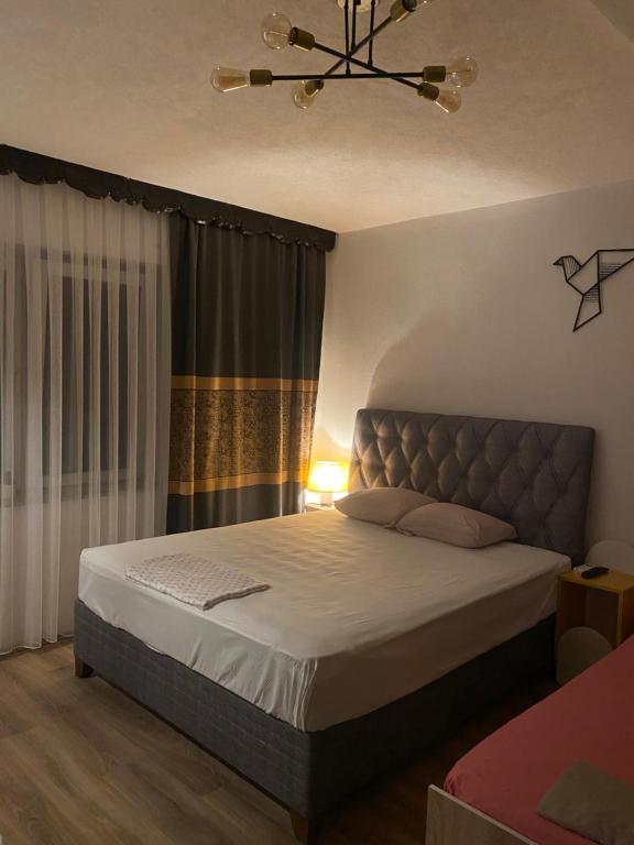 Postel nebo postele na pokoji v ubytování ZANI Hostel
