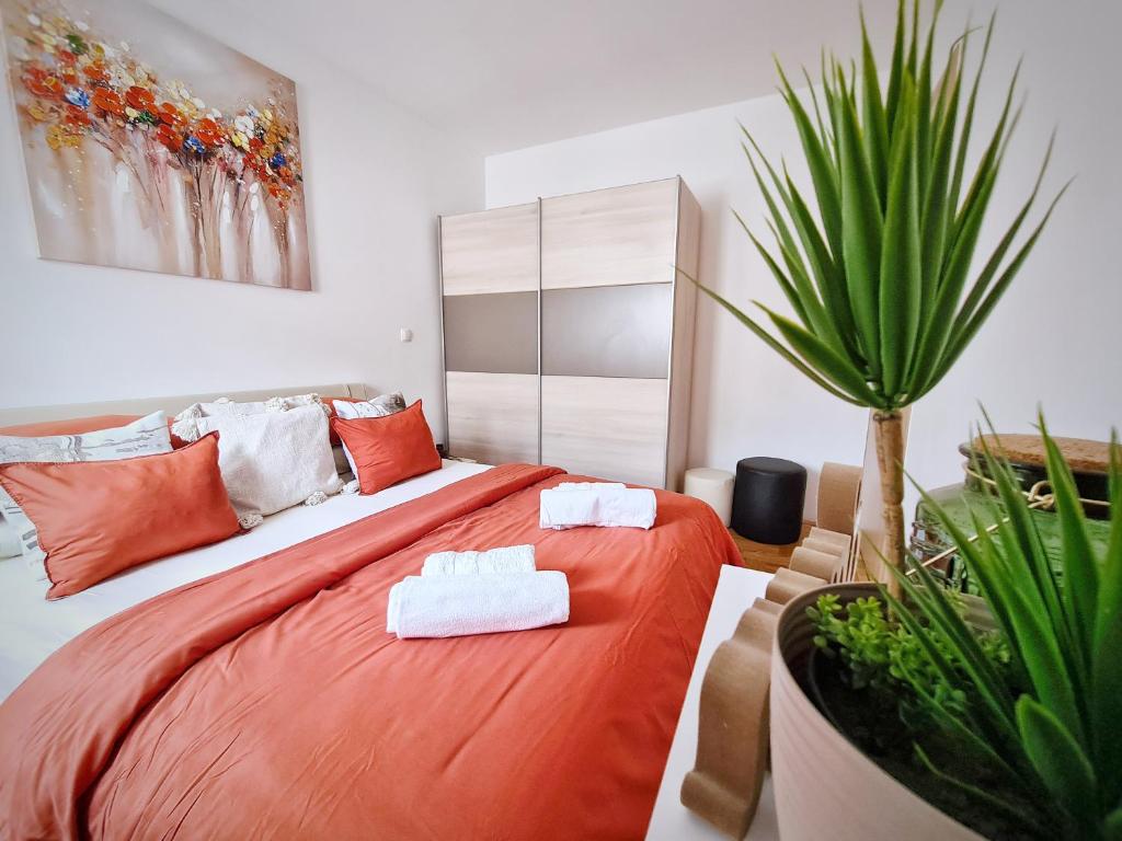 a bedroom with a bed with two towels on it at Luxury apartment Salona in Solin