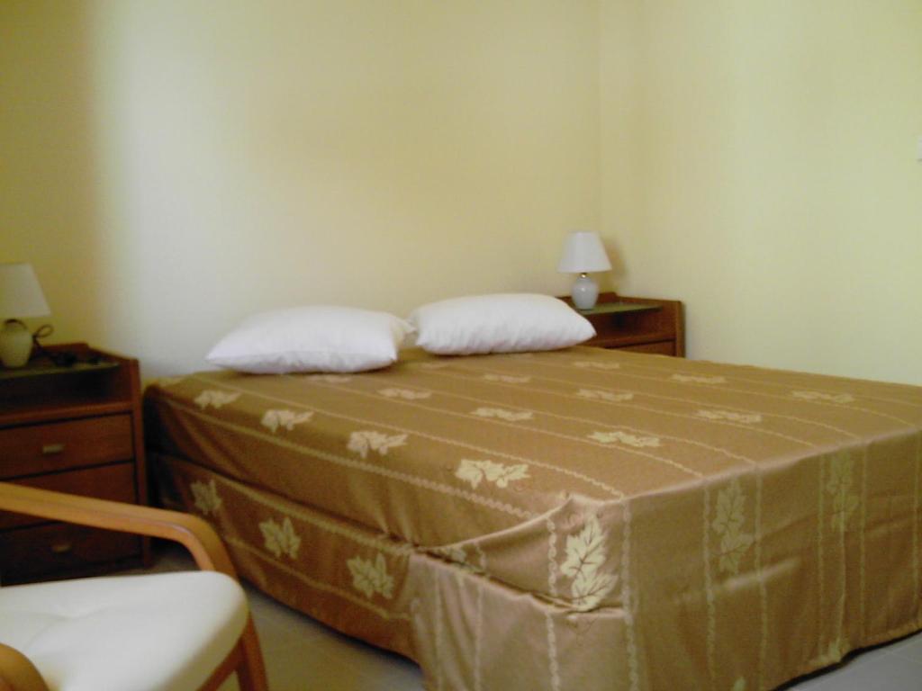 Postel nebo postele na pokoji v ubytování Hotel Lazareto