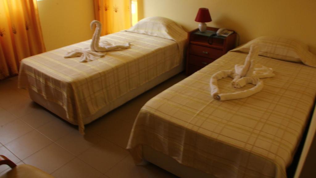 Postel nebo postele na pokoji v ubytování Hotel Lazareto