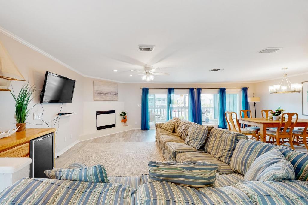 a living room with a couch and a table at Flood Reef Getaway in Pensacola