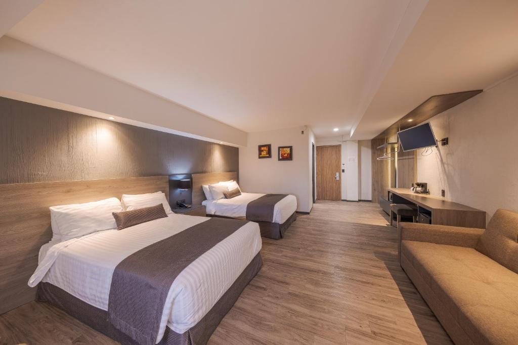 Postel nebo postele na pokoji v ubytování Hotel Malibu