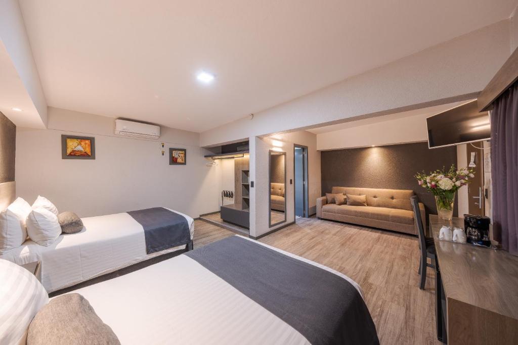 Postel nebo postele na pokoji v ubytování Hotel Malibu