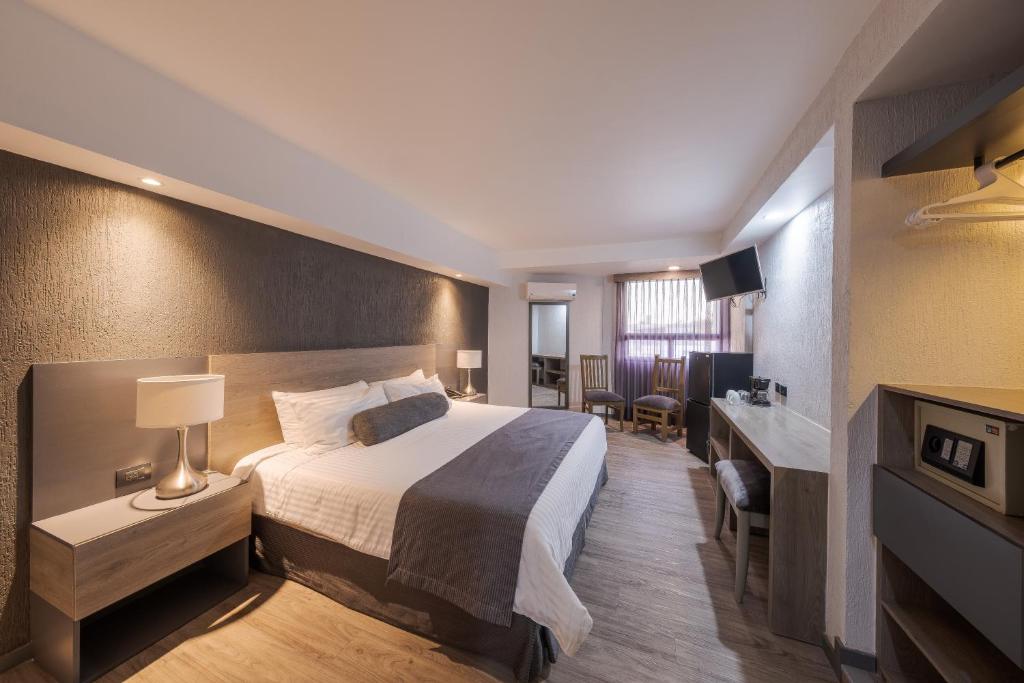 Postel nebo postele na pokoji v ubytování Hotel Malibu