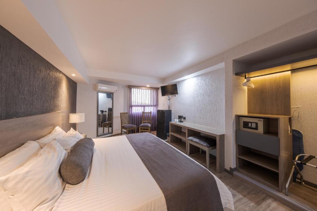 Postel nebo postele na pokoji v ubytování Hotel Malibu