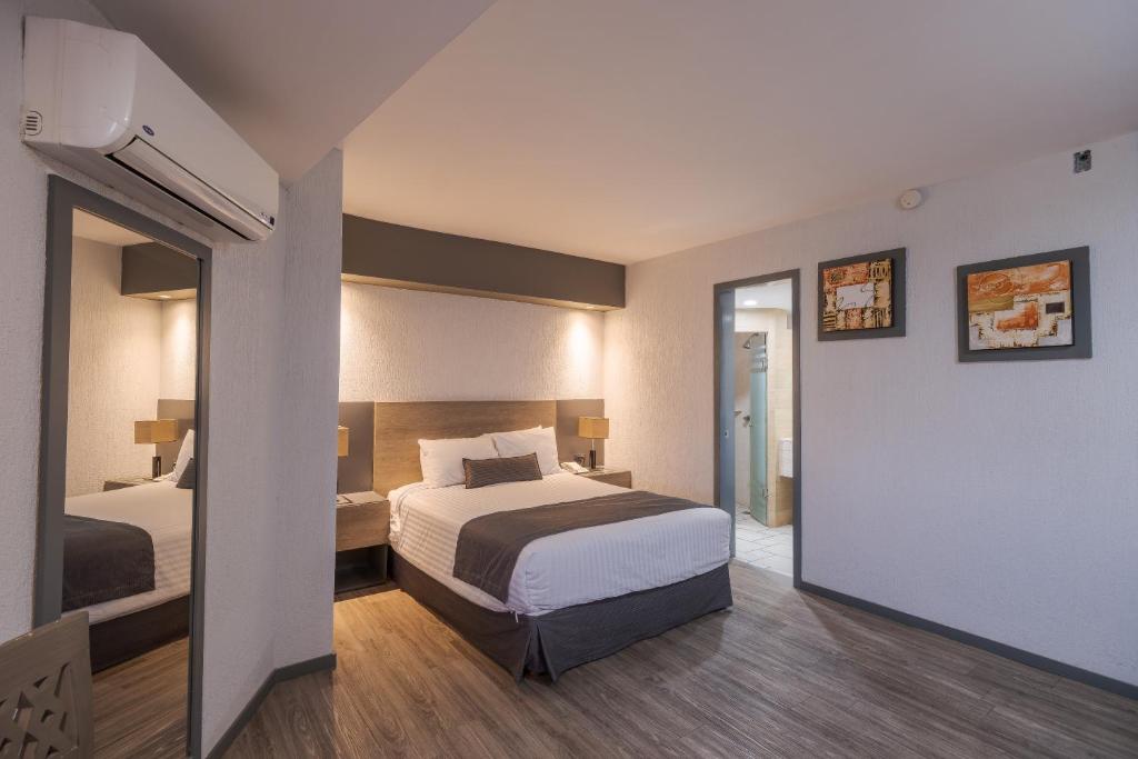 Postel nebo postele na pokoji v ubytování Hotel Malibu