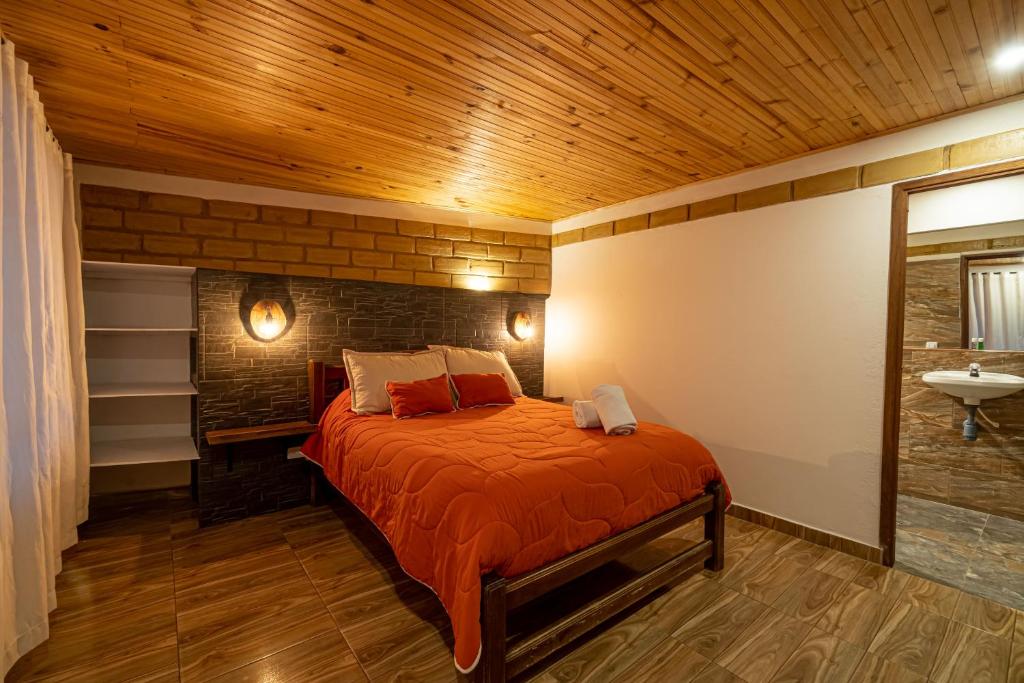Postel nebo postele na pokoji v ubytování Hotel Casa Elemento Villa de Leyva