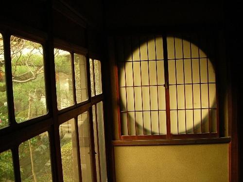 
a window that is open in a room at Guesthouse Nara Backpackers in Nara
