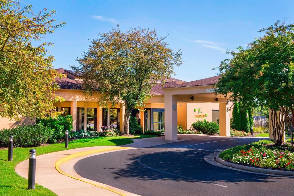 a building with a winding road in front of it at Courtyard by Marriott Charlottesville in Charlottesville