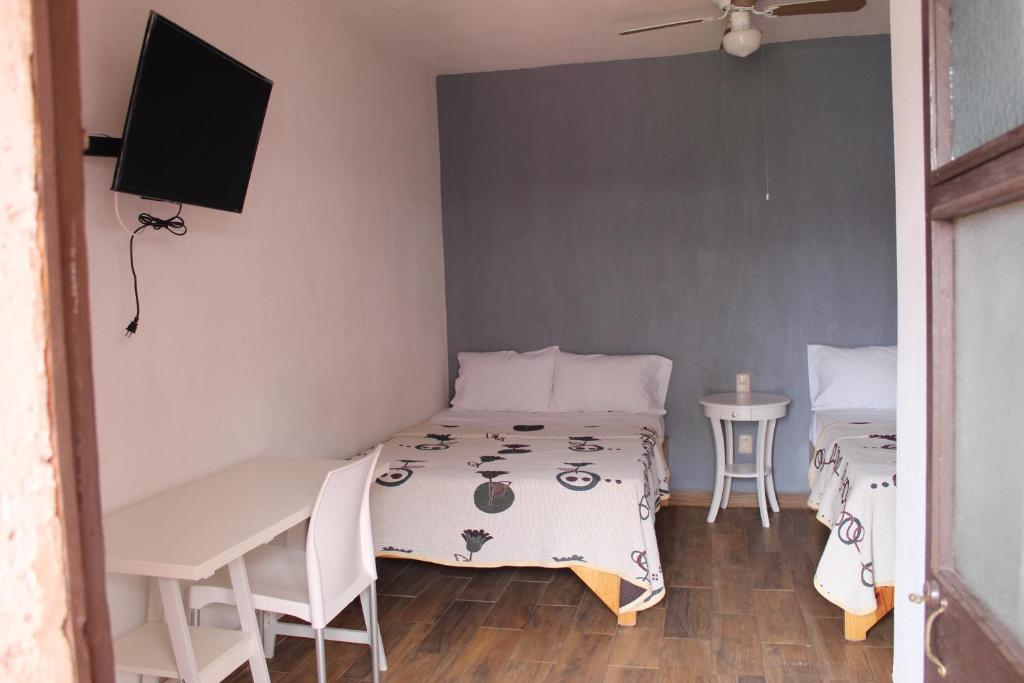 Krevet ili kreveti u jedinici u okviru objekta Hotel el Rinconcito Yuriria Gto