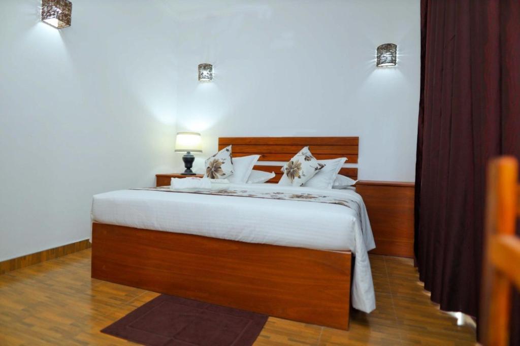Postel nebo postele na pokoji v ubytování Blooming Holiday Resort