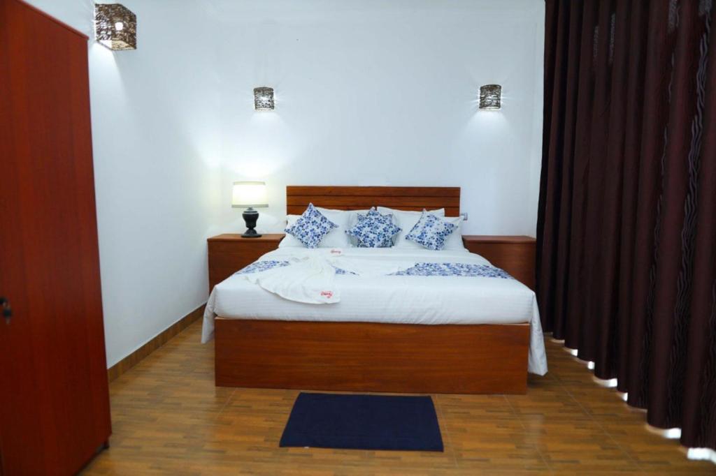 Postel nebo postele na pokoji v ubytování Blooming Holiday Resort