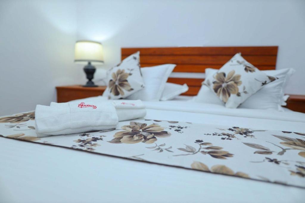 Postel nebo postele na pokoji v ubytování Blooming Holiday Resort
