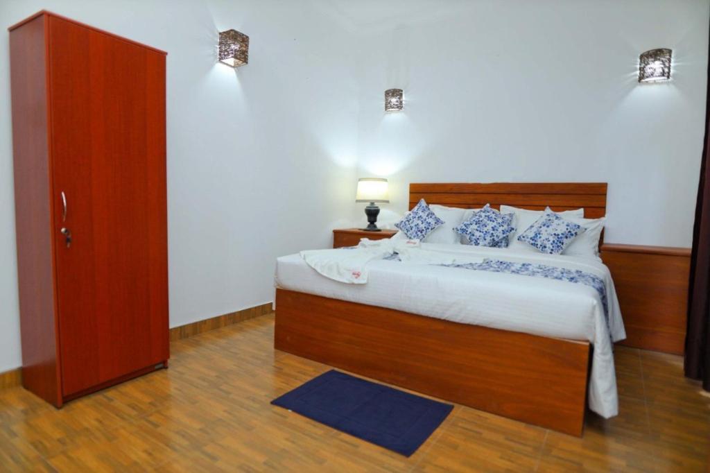 Postel nebo postele na pokoji v ubytování Blooming Holiday Resort
