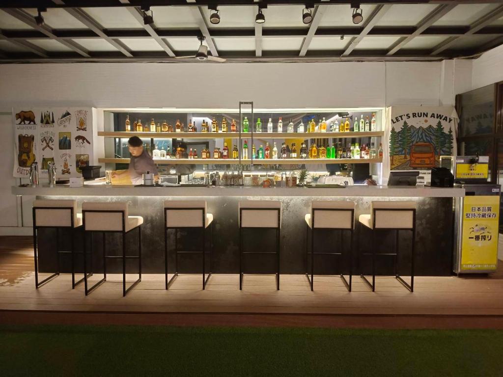 a bar with nine bar stools in a restaurant at Tsun Huang Hotel in Chiayi City