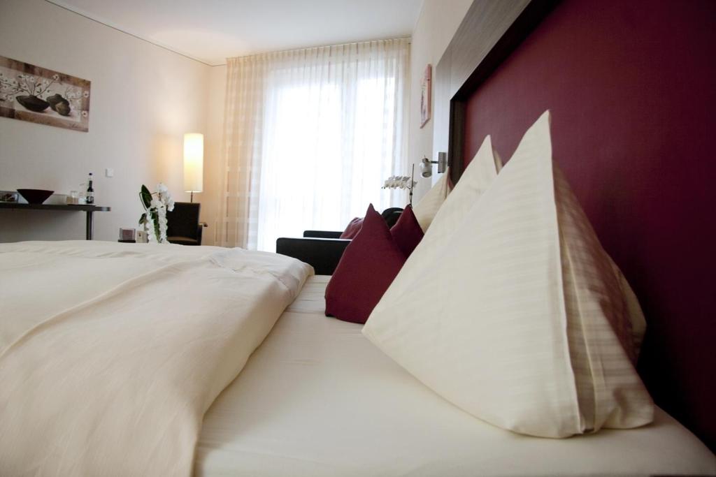 Postel nebo postele na pokoji v ubytování Hotel Linner