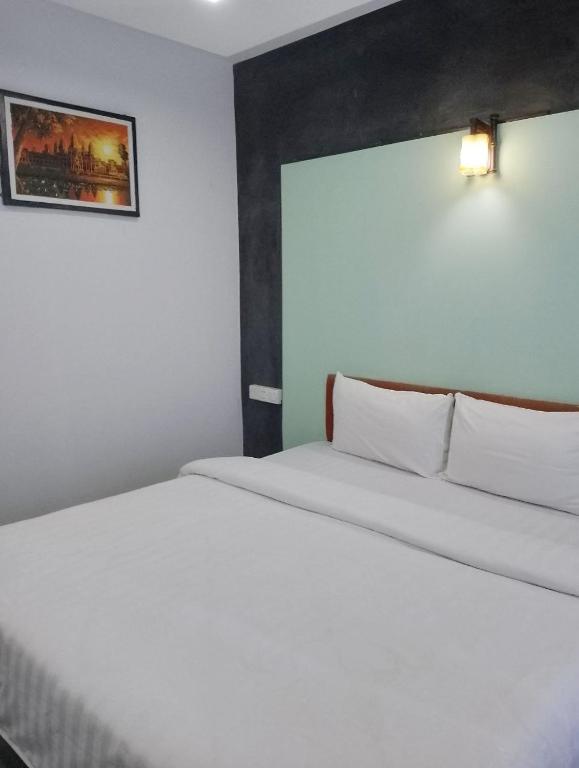 Postel nebo postele na pokoji v ubytování Shalima Guesthouse