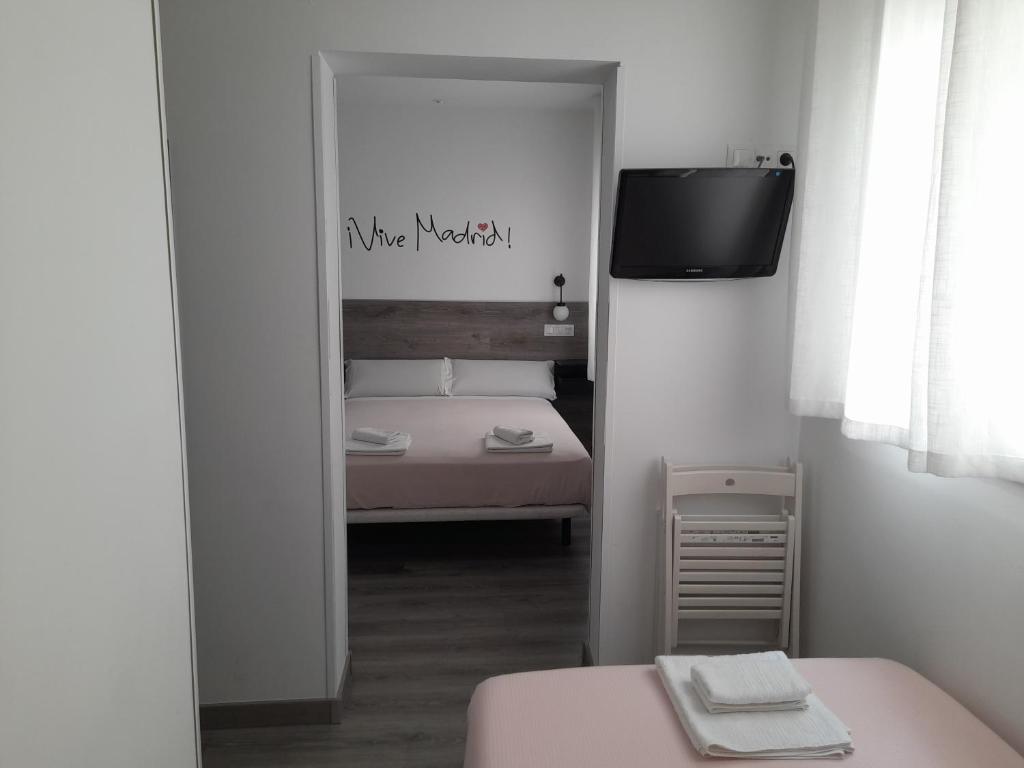Postel nebo postele na pokoji v ubytování CH Bueno