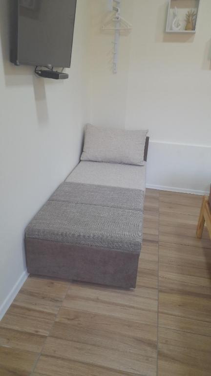 Posteľ alebo postele v izbe v ubytovaní Magnolia apartman