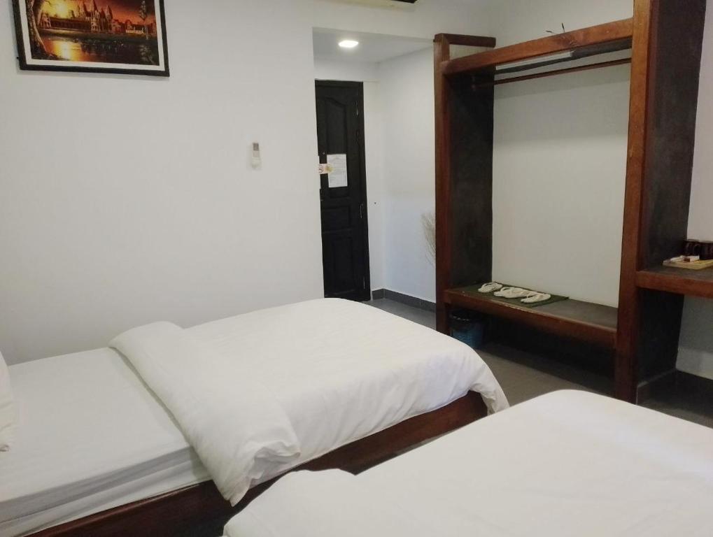 Postel nebo postele na pokoji v ubytování Shalima Guesthouse