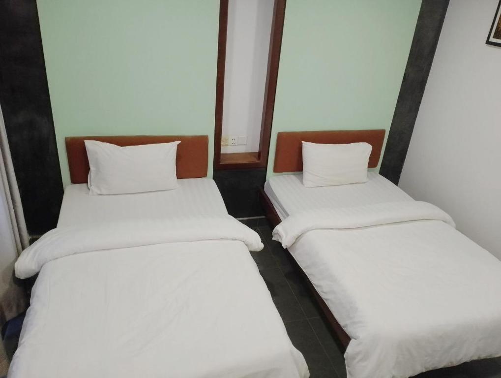 Postel nebo postele na pokoji v ubytování Shalima Guesthouse