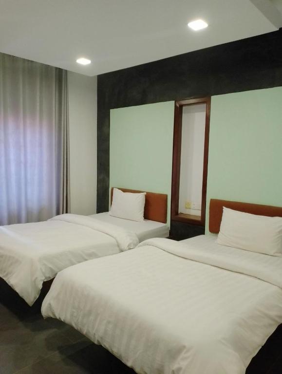 Postel nebo postele na pokoji v ubytování Shalima Guesthouse
