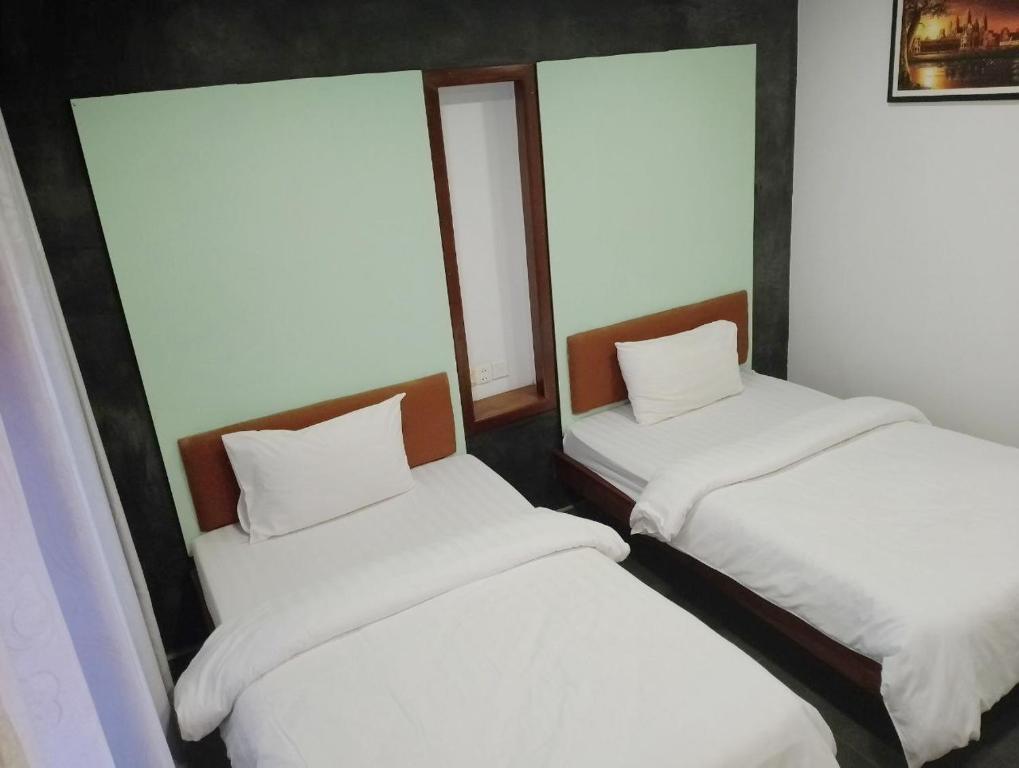 Postel nebo postele na pokoji v ubytování Shalima Guesthouse