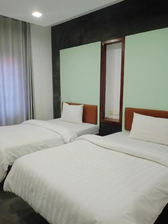 Postel nebo postele na pokoji v ubytování Shalima Guesthouse