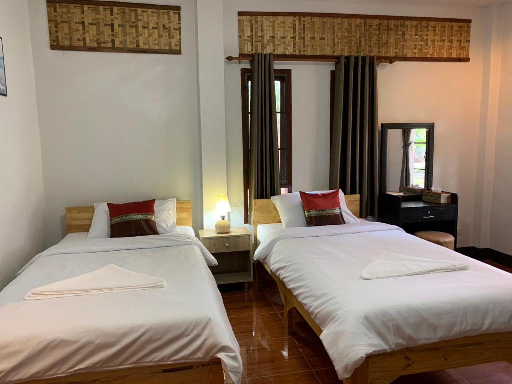 Postel nebo postele na pokoji v ubytování Hotel Pailifornia