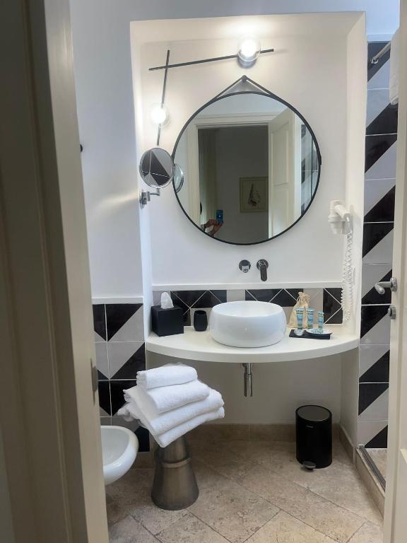 a bathroom with a sink and a mirror at Hotel Orsa Maggiore in Anacapri