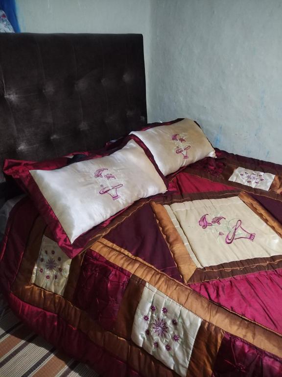 Postel nebo postele na pokoji v ubytování auberge yeswal aoulad yaakoube