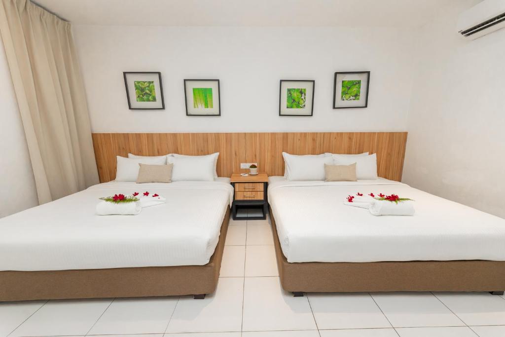 Postel nebo postele na pokoji v ubytování The Villa Langkawi
