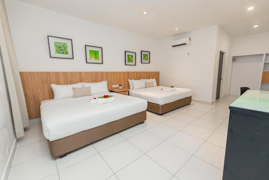 Postel nebo postele na pokoji v ubytování The Villa Langkawi