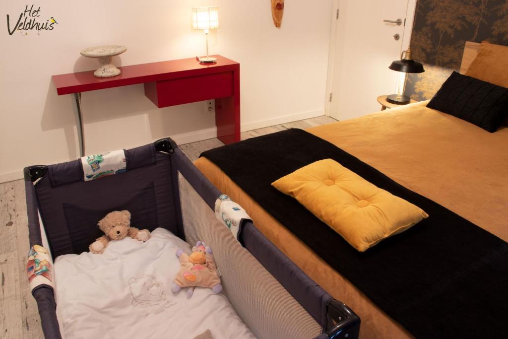 Postel nebo postele na pokoji v ubytování Het Veldhuis
