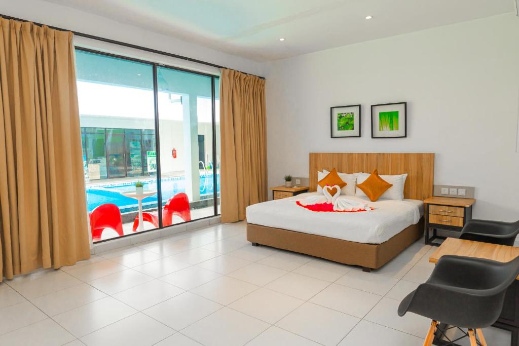 Postel nebo postele na pokoji v ubytování The Villa Langkawi