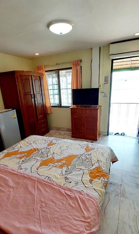 Postel nebo postele na pokoji v ubytování Tientong Guesthouse