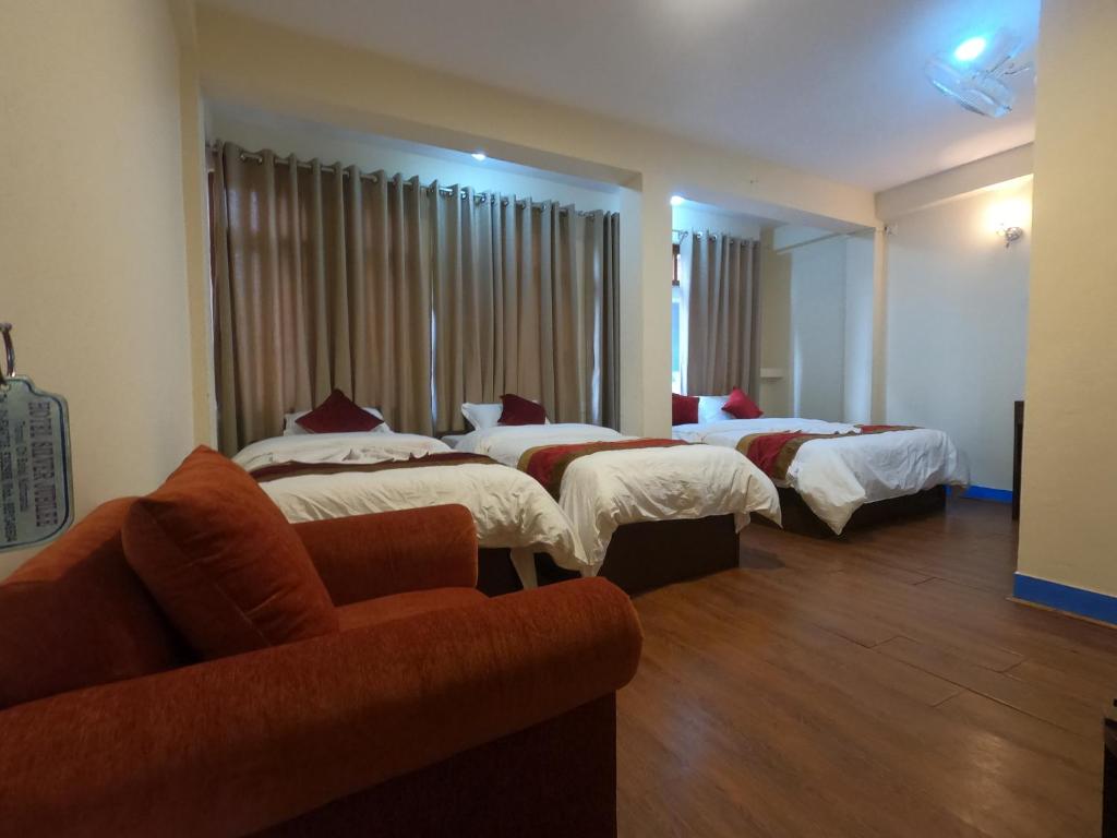Postel nebo postele na pokoji v ubytování Hotel Silver Jubilee