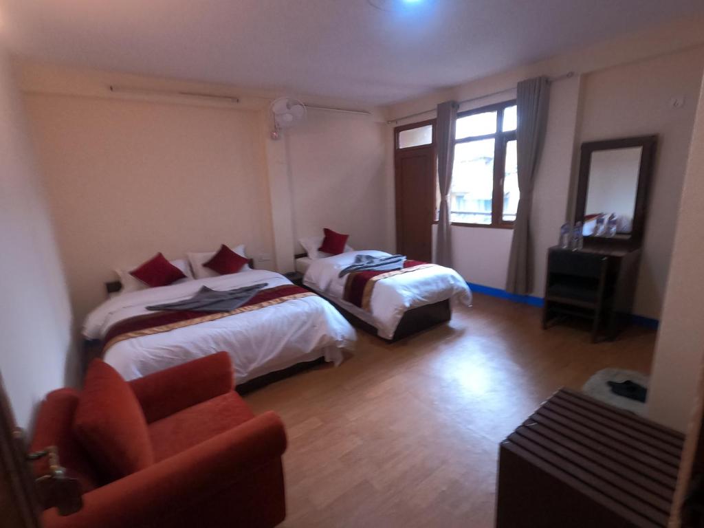 Postel nebo postele na pokoji v ubytování Hotel Silver Jubilee