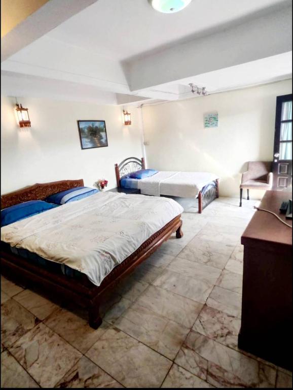 Postel nebo postele na pokoji v ubytování Tientong Guesthouse