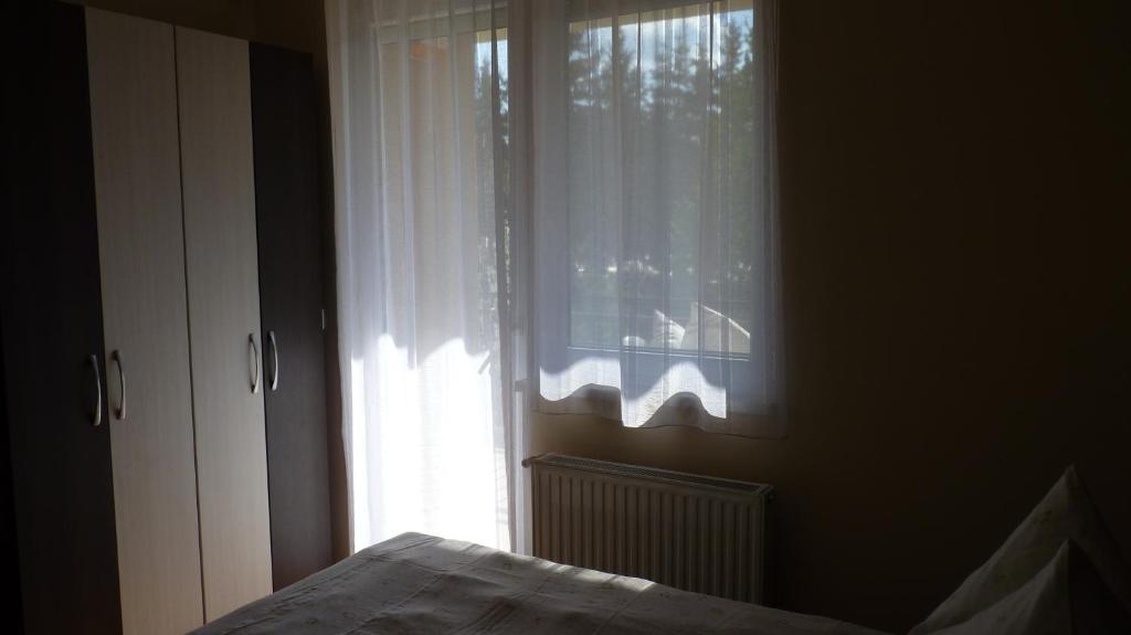 Posteľ alebo postele v izbe v ubytovaní Azur Wellness Apartman