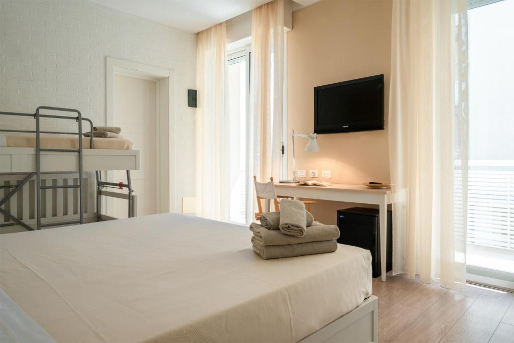 Postel nebo postele na pokoji v ubytování Hotel Bristol