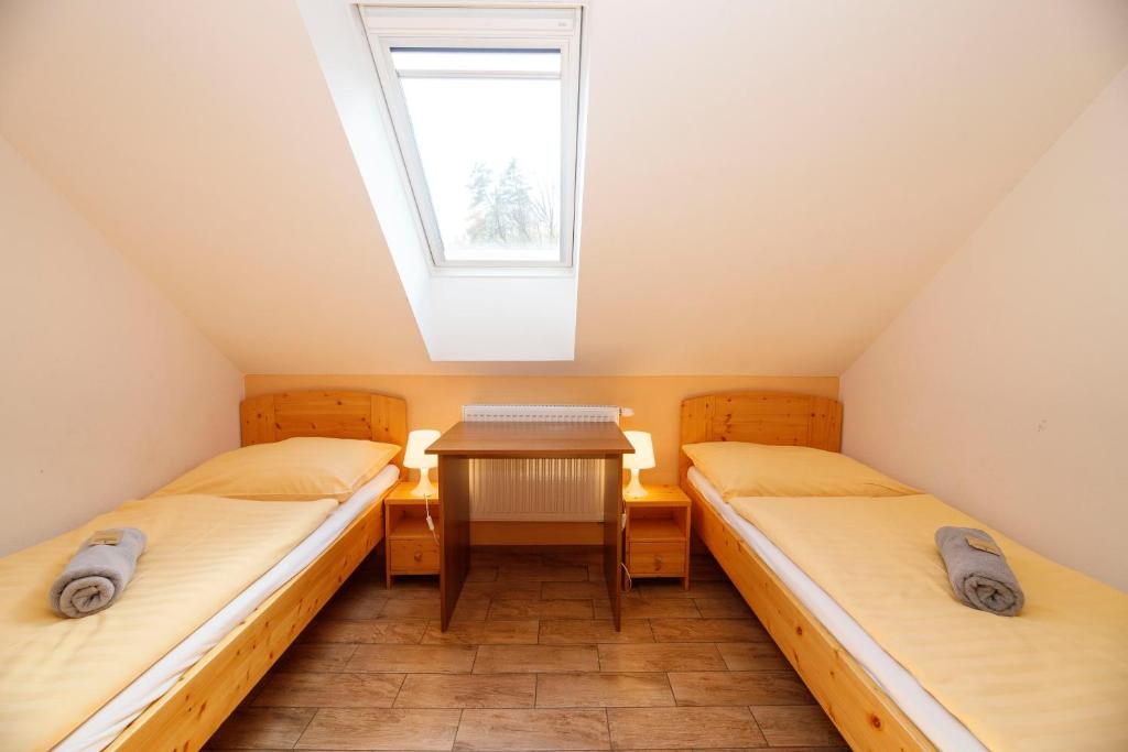 Postel nebo postele na pokoji v ubytování Pod Břesteckou skalou