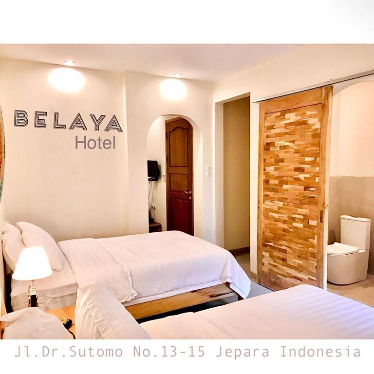Postel nebo postele na pokoji v ubytování Belaya Hotel