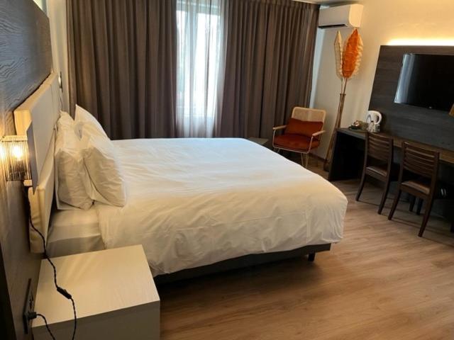Postel nebo postele na pokoji v ubytování Hotel Malpertuus